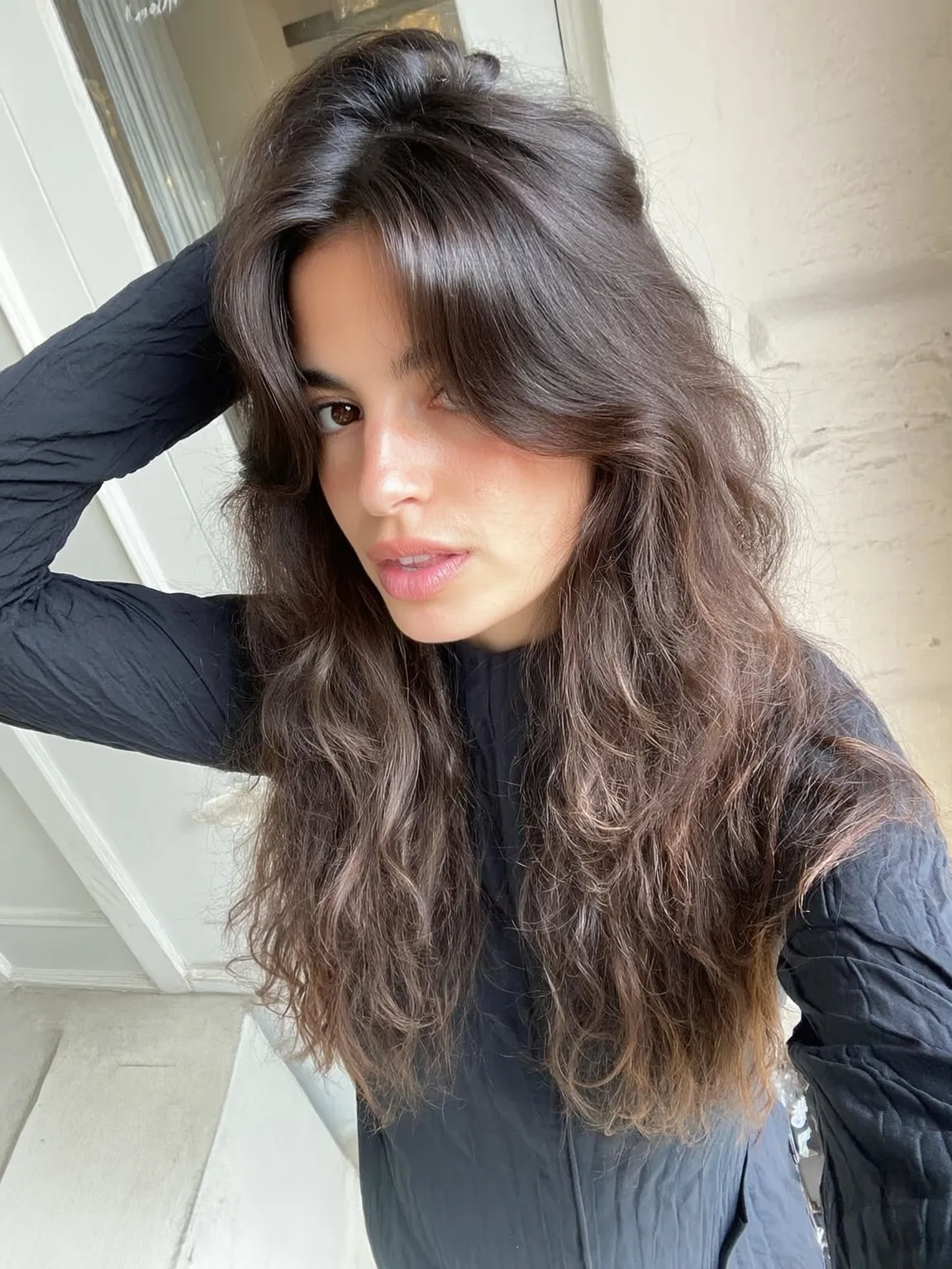 Voluminous Long Wavy Layers with Curtain Bangs